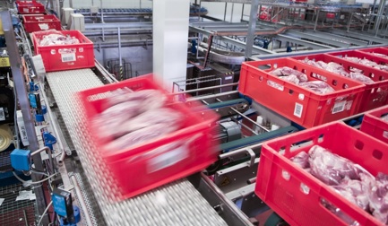 How can meat processors benefit from an intralogistics system?